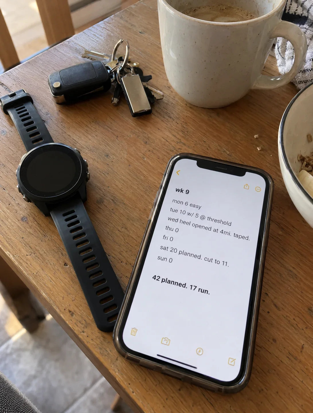 A phone showing a week nine training log in a notes app: 42 planned, 17 run