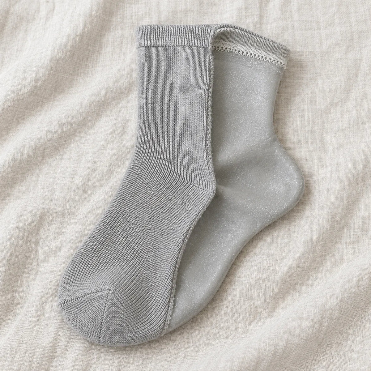 Day Sock half-inside-out so the silicone and the ordinary outside face are in one frame.